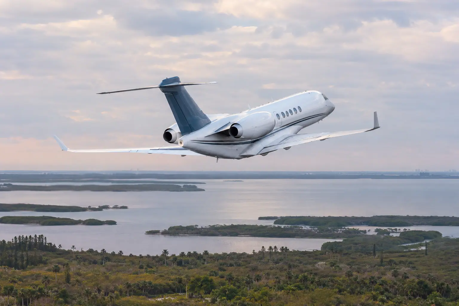 Private jet climbing out over Tampa